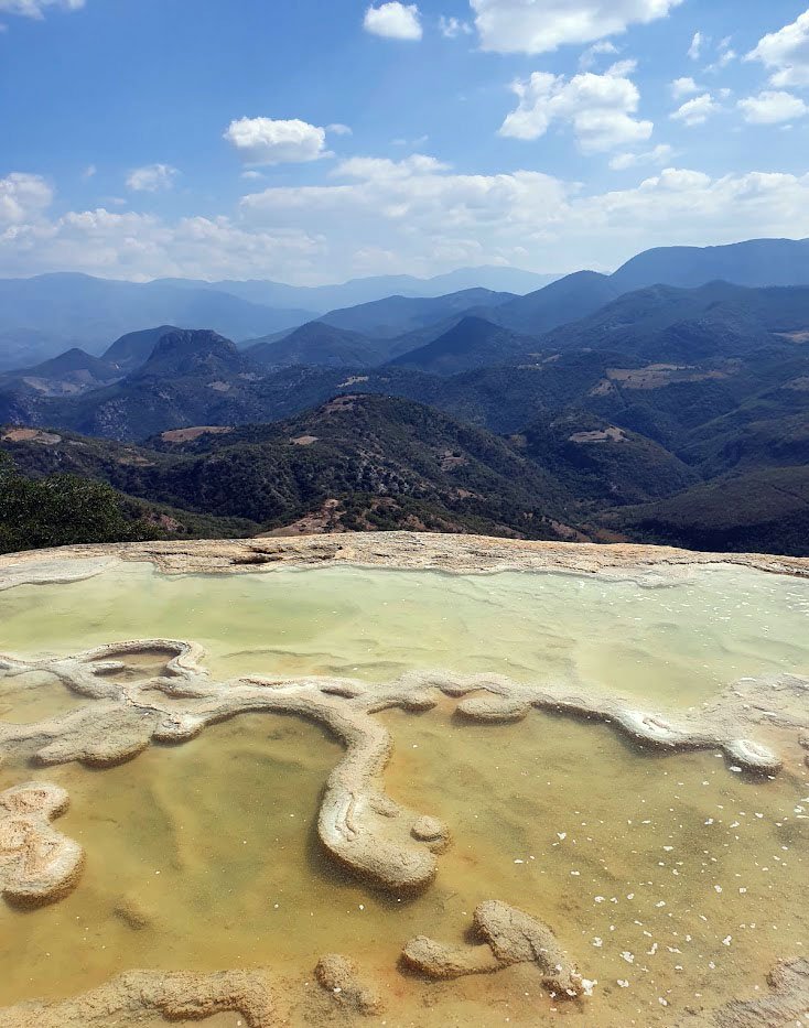 Hierve el Agua Pool from up close with mountain backdrop, Oaxaca, Mexico