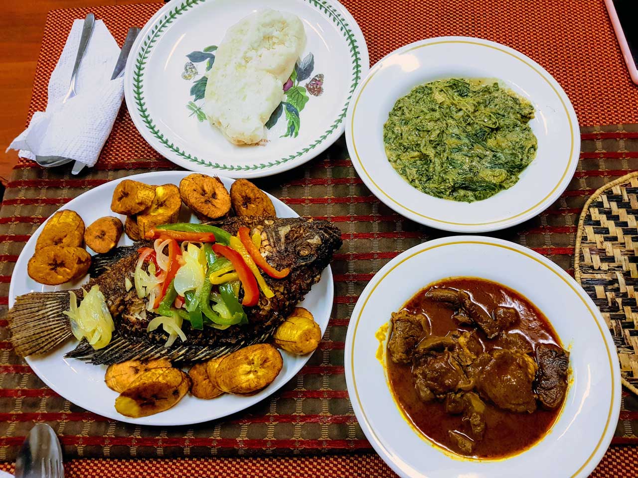 Mixed dishes (tilapia, nut spinach) at Jambo Ugandan Restaurant, Seven Sisters, London