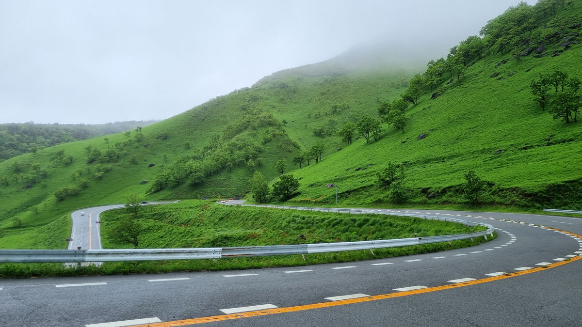 Road winding up and out of Yufuin, Japan