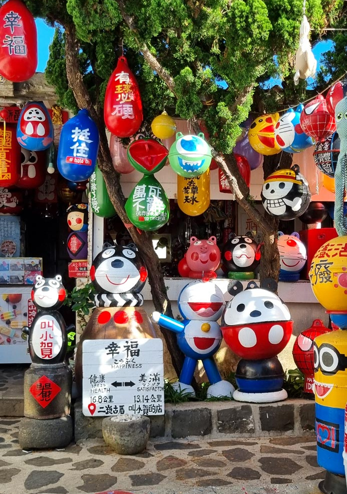 Painted buoy art cartoon characters in Erkan village, Penghu Islands, Taiwan