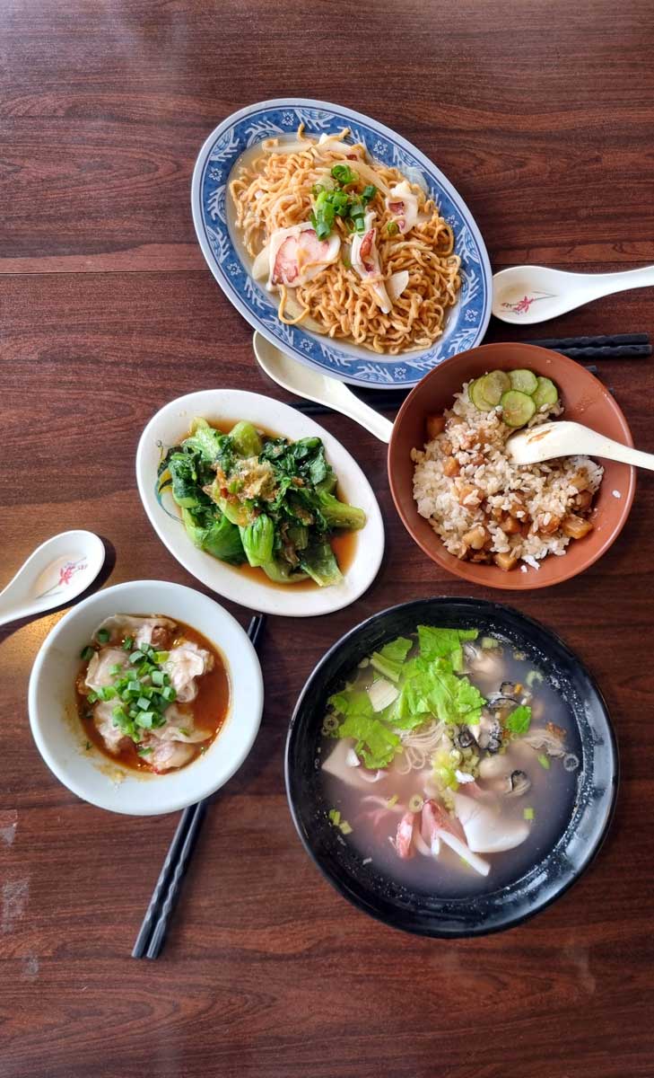 Squid noodles and side dishes in Huxi seafood restaurant, Penghu Islands, Taiwan