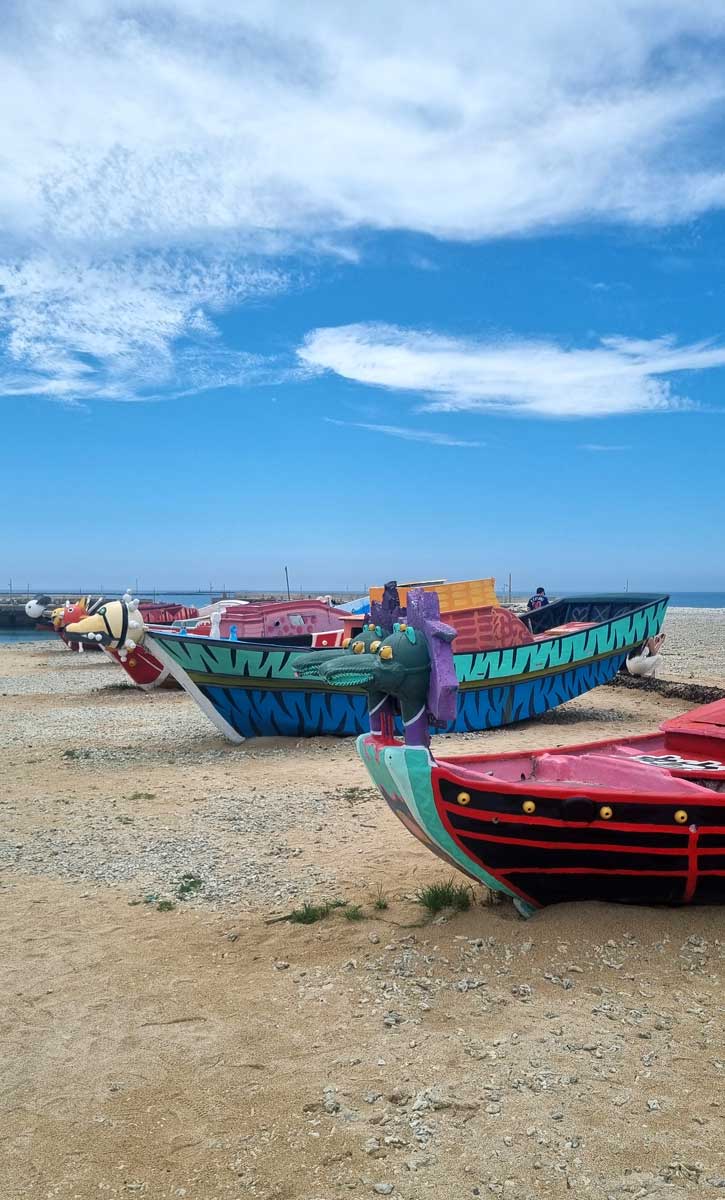 Colourful boats on Houliao Beach, Penghu Islands, Taiwan
