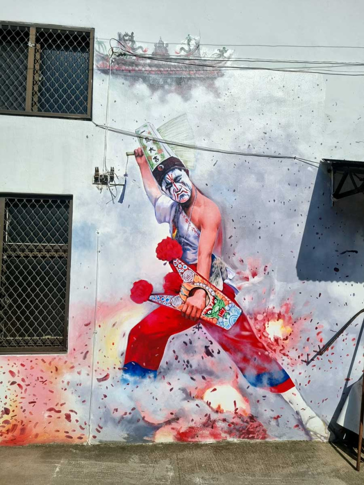 Traditional Chinese performer art murals and flowers in Neiwei Village, Kaohsiung, Taiwan