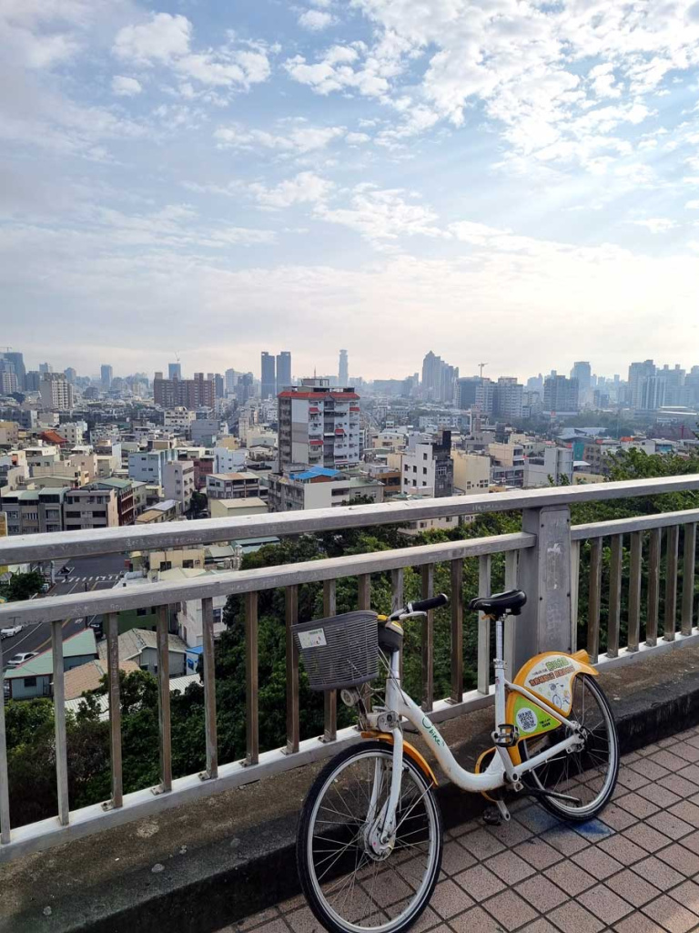 uBike rental bicycle with Kaohsiung skyline in background, Taiwan
