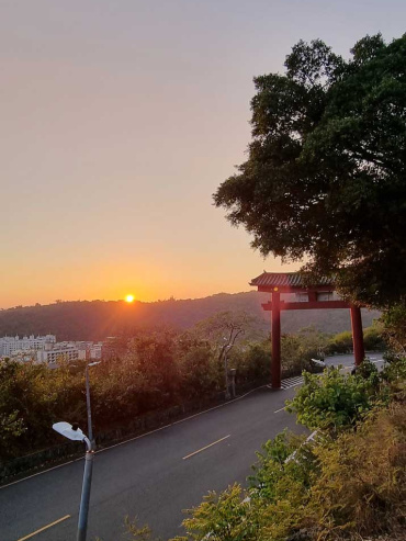 Sunset over a road and tori gate in Shoushan, Kaohsiung, Taiwan